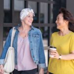 Two women walking and talking